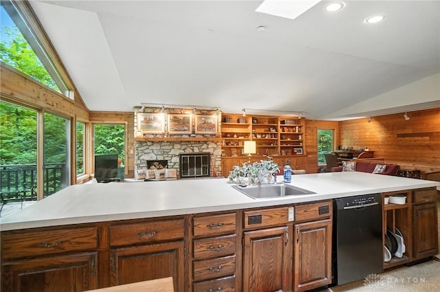 1917 Antrim Ct, Middletown, OH 45042 - kitchen with black dishwasher, lofted ceiling, open floor plan, wood walls, and plenty of natural light