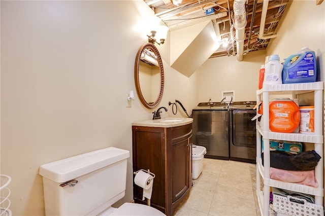 4930 Wildoak Ct, Dayton, OH 45424 - half bath with washer and dryer, vanity, and tile patterned flooring