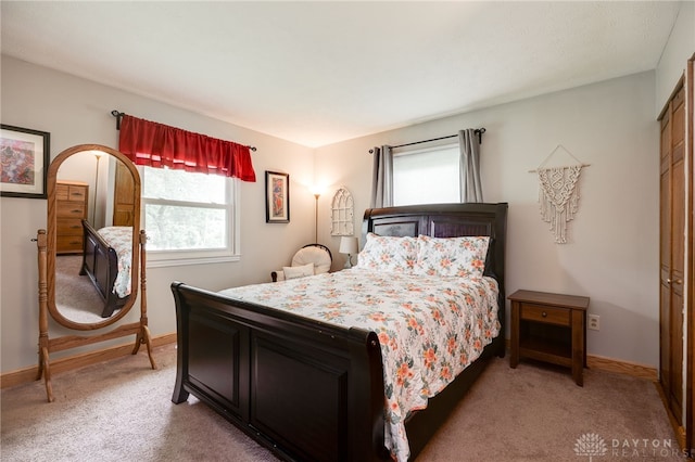 4930 Wildoak Ct, Dayton, OH 45424 - bedroom with light carpet and a closet