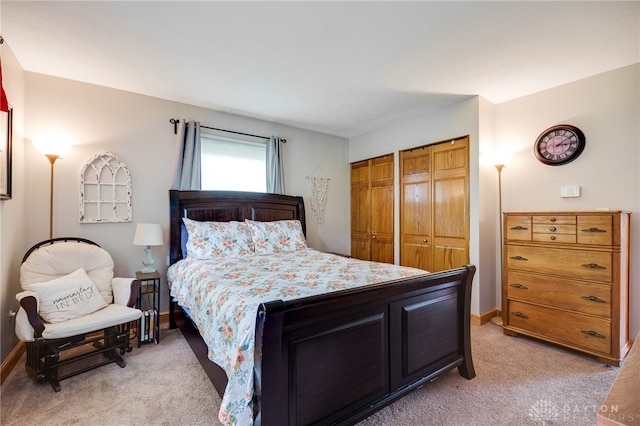 4930 Wildoak Ct, Dayton, OH 45424 - bedroom with light carpet and two closets