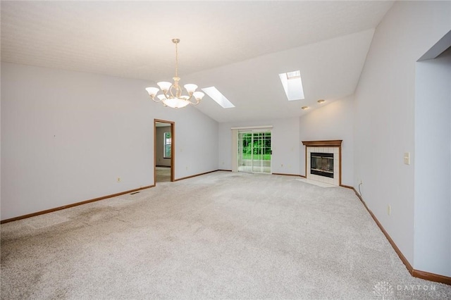 995 Wren Ct, Monroe, OH 45050 - unfurnished living room with light carpet, a skylight, lofted ceiling, a chandelier, and a tiled fireplace
