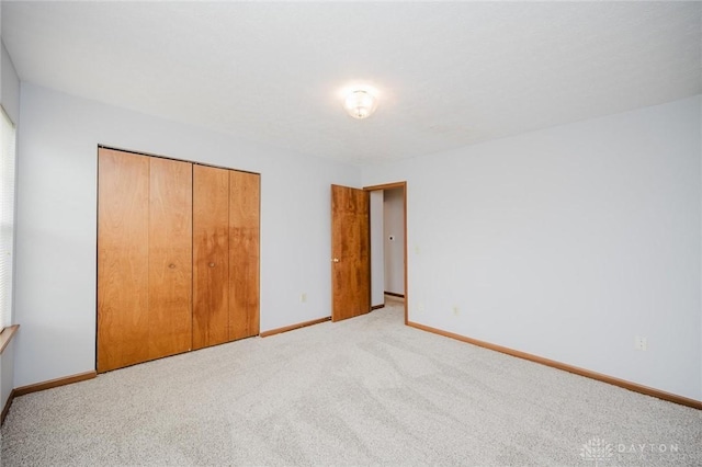 995 Wren Ct, Monroe, OH 45050 - unfurnished bedroom with a closet and light carpet
