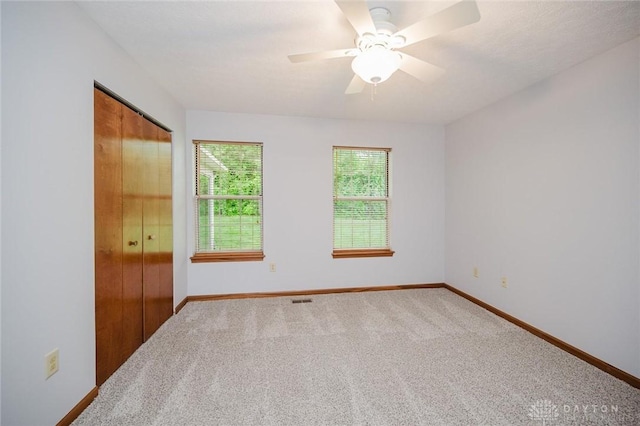 995 Wren Ct, Monroe, OH 45050 - unfurnished bedroom with carpet, a closet, and a ceiling fan