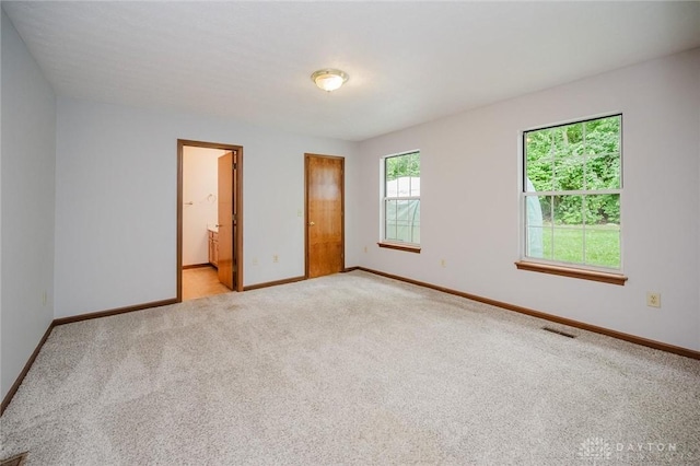 995 Wren Ct, Monroe, OH 45050 - unfurnished bedroom featuring light carpet and ensuite bath