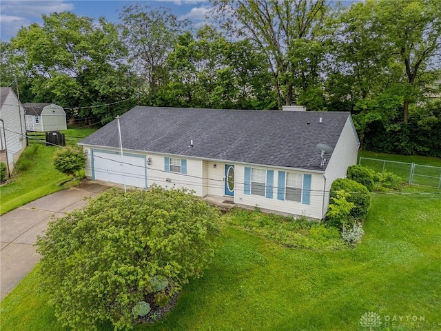 995 Wren Ct, Monroe, OH 45050 - view of front of house with concrete driveway, a garage, roof with shingles, and view of scattered trees