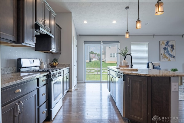 1693 Sunset Canyon Ct, Fairborn, OH 45324 - kitchen with stainless steel appliances, under cabinet range hood, hardwood / wood-style floors, a kitchen island with sink, and dark brown cabinets