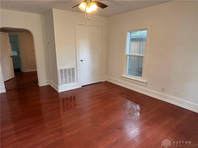 18 E Xenia St, Jamestown Vlg, OH 45335 - empty room with ceiling fan, arched walkways, and wood finished floors