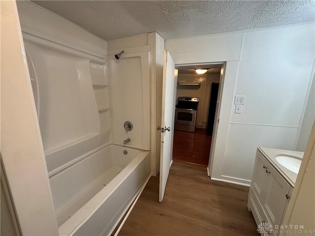 18 E Xenia St, Jamestown Vlg, OH 45335 - full bathroom featuring wood finished floors, vanity, a textured ceiling, and shower / bath combination