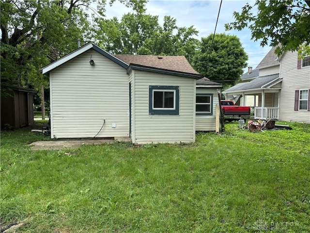 18 E Xenia St, Jamestown Vlg, OH 45335 - rear view of property featuring a lawn and a shingled roof