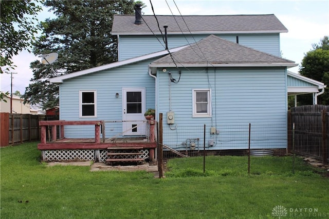 302 W 1st St, Arcanum, OH 45304 - rear view of house featuring a deck, a fenced backyard, and a shingled roof