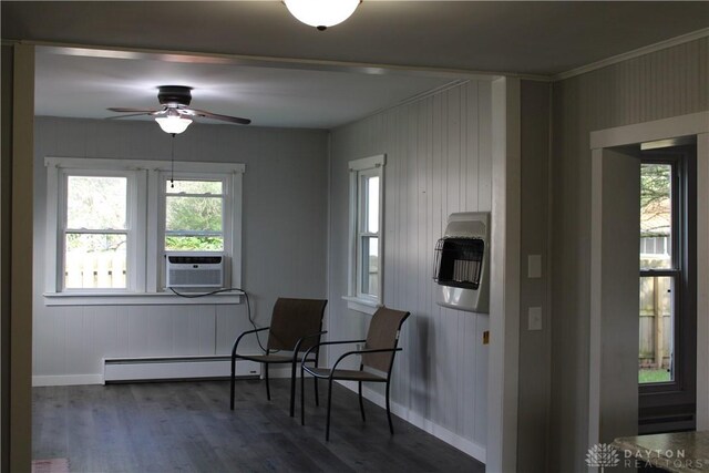 302 W 1st St, Arcanum, OH 45304 - living area featuring baseboard heating, heating unit, cooling unit, a ceiling fan, and dark wood-type flooring