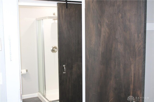 302 W 1st St, Arcanum, OH 45304 - bathroom featuring a stall shower and baseboards
