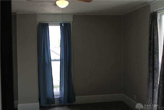 302 W 1st St, Arcanum, OH 45304 - unfurnished room featuring plenty of natural light, ornamental molding, and a ceiling fan