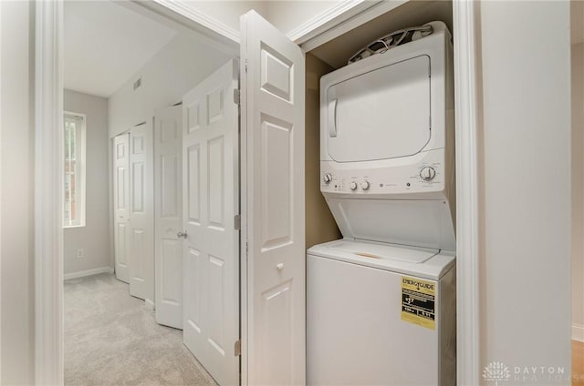 964 Auburnview Dr Unit 3E, Cincinnati, OH 45206 - laundry room with stacked washer / dryer and light colored carpet