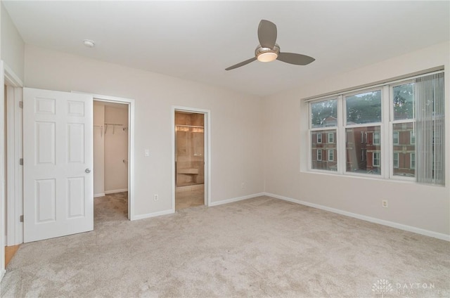 964 Auburnview Dr Unit 3E, Cincinnati, OH 45206 - unfurnished bedroom with a spacious closet, carpet flooring, a closet, ensuite bath, and a ceiling fan