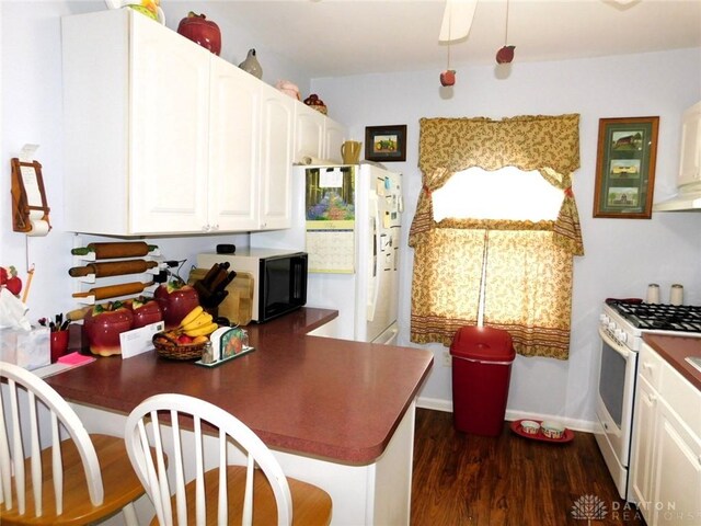 316 Center St, Lebanon, OH 45036 - kitchen with white range with gas cooktop, white cabinetry, a peninsula, and dark wood-type flooring