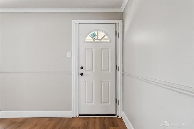 610 N Spring St, Wilmington, OH 45177 - doorway with dark wood-type flooring and crown molding