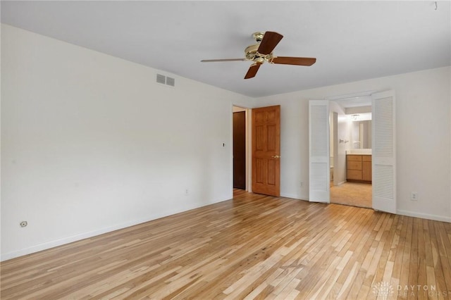 1620 Ambridge Rd, Dayton, OH 45459 - unfurnished bedroom with light wood-style floors, ensuite bathroom, and a ceiling fan