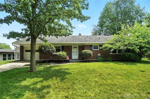 924 Fairacres Dr, Kettering, OH 45429 - ranch-style home featuring a front yard, brick siding, concrete driveway, and an attached garage