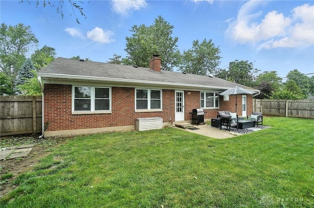 924 Fairacres Dr, Kettering, OH 45429 - rear view of house featuring brick siding, an outdoor living space, a chimney, a fenced backyard, and a patio