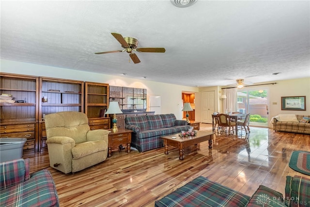 9131 Shawhan Dr, Centerville, OH 45458 - living room with ceiling fan, wood finished floors, and a textured ceiling