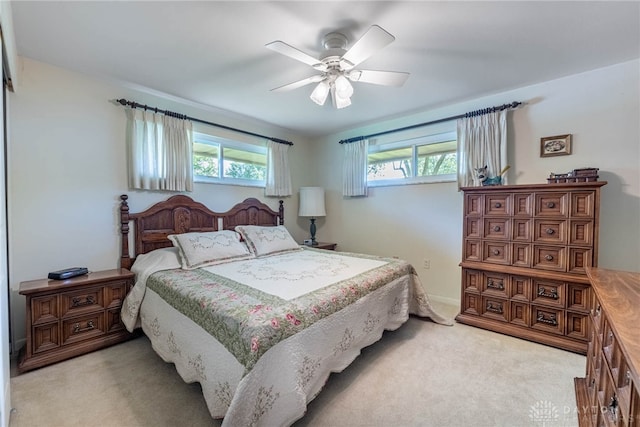 9131 Shawhan Dr, Centerville, OH 45458 - bedroom featuring multiple windows, light carpet, and a ceiling fan