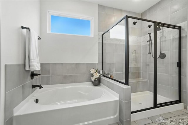 4835 Granada Ct, Liberty Twp, OH 45044 - full bathroom with a garden tub, a shower stall, and tile patterned floors