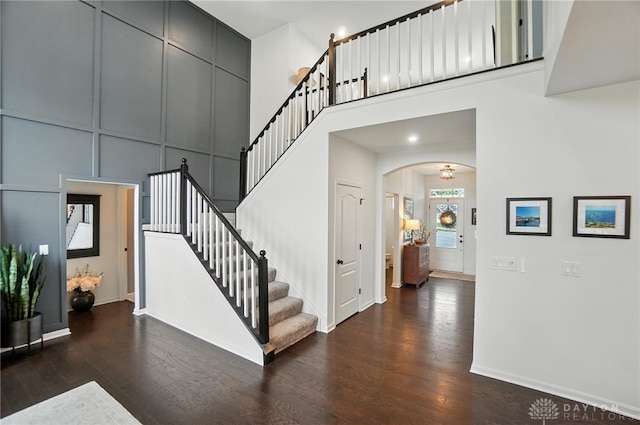 4835 Granada Ct, Liberty Twp, OH 45044 - stairs with wood finished floors, a high ceiling, and arched walkways