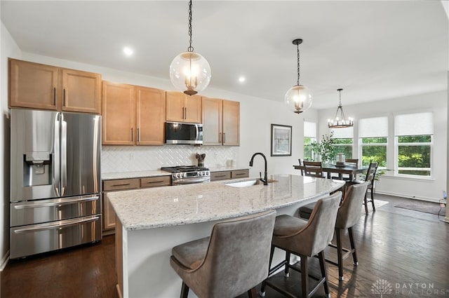4835 Granada Ct, Liberty Twp, OH 45044 - kitchen with stainless steel appliances, backsplash, light stone countertops, dark wood-type flooring, and recessed lighting