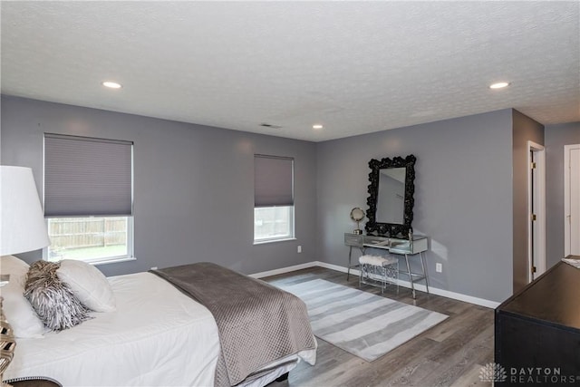 160 Worthington Dr, Germantown, OH 45327 - bedroom with wood finished floors, recessed lighting, and a textured ceiling