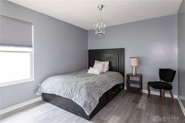 160 Worthington Dr, Germantown, OH 45327 - bedroom with wood finished floors and a chandelier