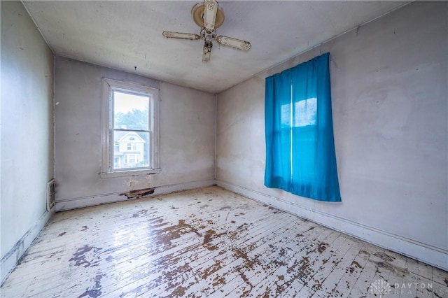 246 N D St, Hamilton, OH 45013 - empty room with wood finished floors and a ceiling fan