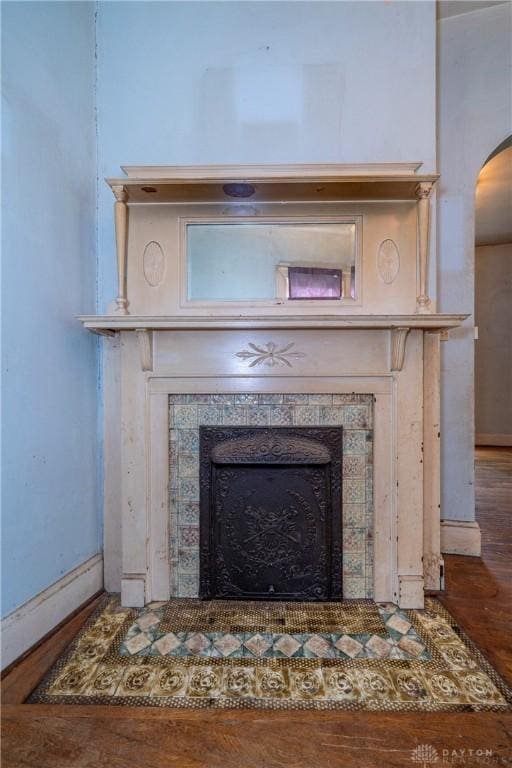 246 N D St, Hamilton, OH 45013 - detailed view of a fireplace, arched walkways, and wood finished floors