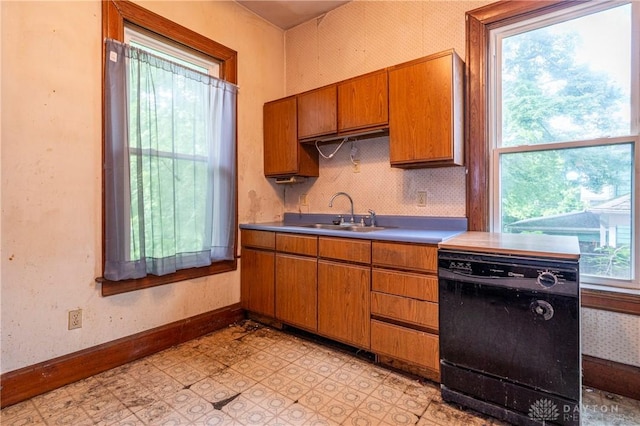 246 N D St, Hamilton, OH 45013 - kitchen featuring dishwasher, brown cabinetry, light floors, and tasteful backsplash