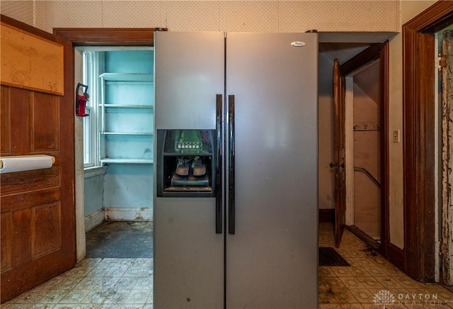 246 N D St, Hamilton, OH 45013 - kitchen with stainless steel fridge with ice dispenser, light floors, and wallpapered walls