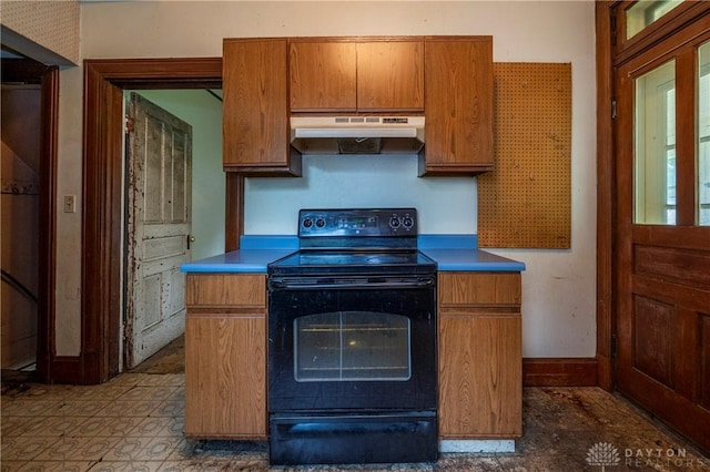 246 N D St, Hamilton, OH 45013 - kitchen featuring under cabinet range hood, black range with electric cooktop, and brown cabinetry
