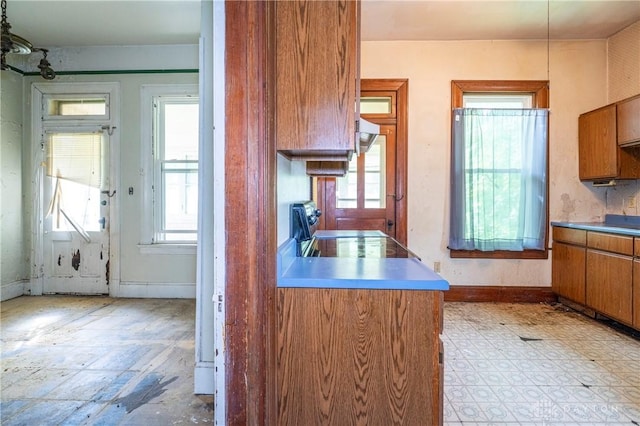 246 N D St, Hamilton, OH 45013 - kitchen featuring stove, plenty of natural light, and brown cabinets
