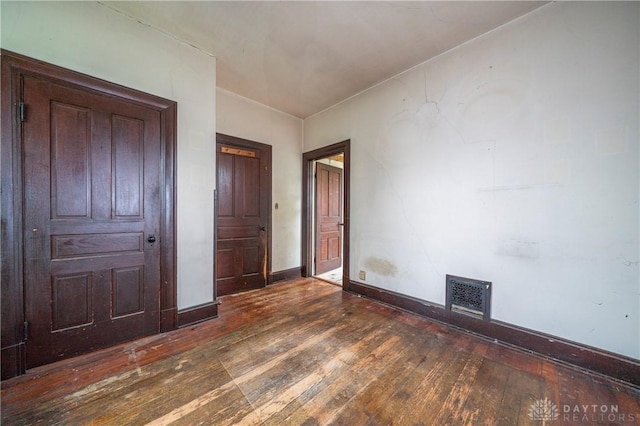 246 N D St, Hamilton, OH 45013 - unfurnished bedroom with hardwood / wood-style flooring and baseboards