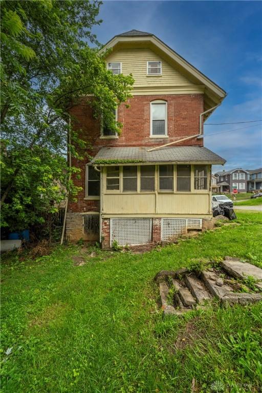 246 N D St, Hamilton, OH 45013 - back of house featuring a lawn