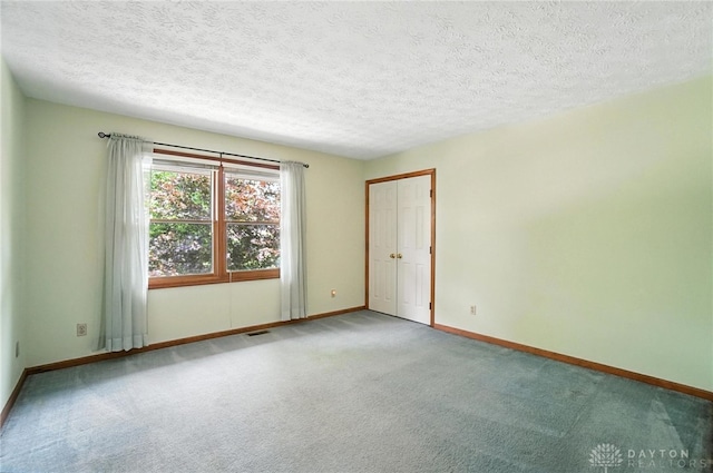 356 Saint James Pl, Springboro, OH 45066 - carpeted spare room with baseboards and a textured ceiling
