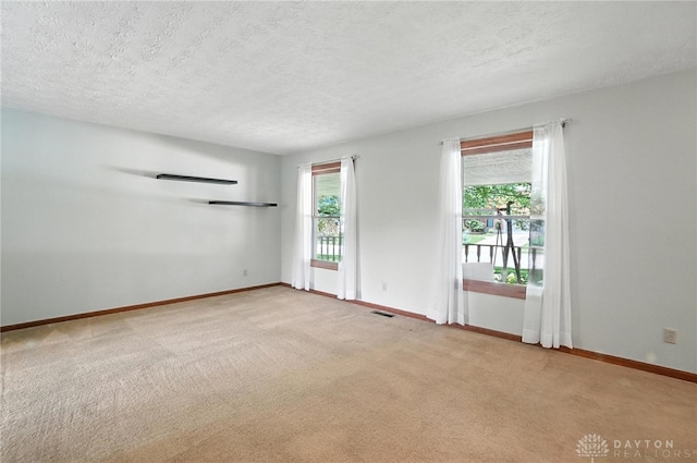 356 Saint James Pl, Springboro, OH 45066 - carpeted empty room with baseboards and a textured ceiling