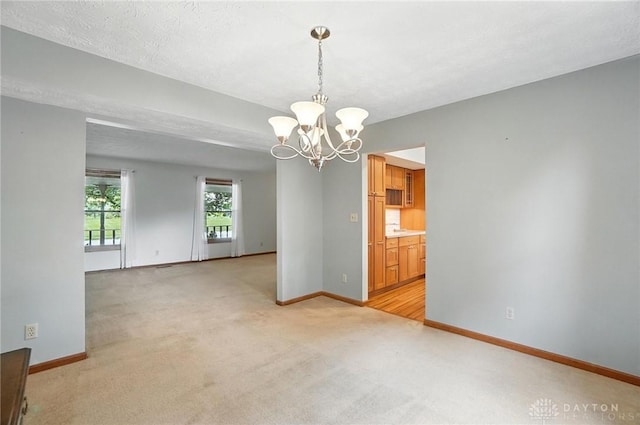 356 Saint James Pl, Springboro, OH 45066 - empty room with light carpet and a chandelier
