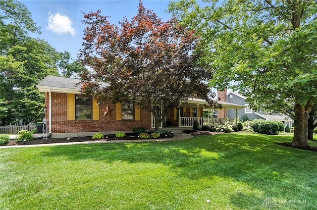356 Saint James Pl, Springboro, OH 45066 - obstructed view of property featuring brick siding, a front yard, and a porch