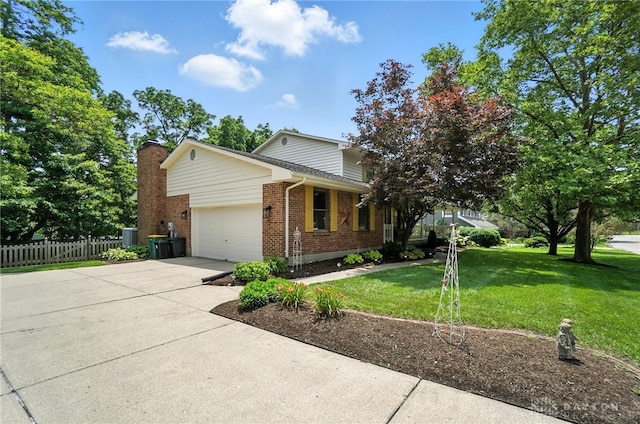 356 Saint James Pl, Springboro, OH 45066 - view of front of home featuring brick siding, an attached garage, driveway, and a chimney