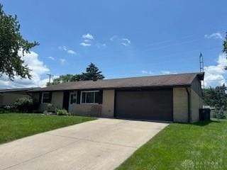 1006 Terracewood Dr, Englewood, OH 45322 - ranch-style house featuring an attached garage, driveway, and a front yard