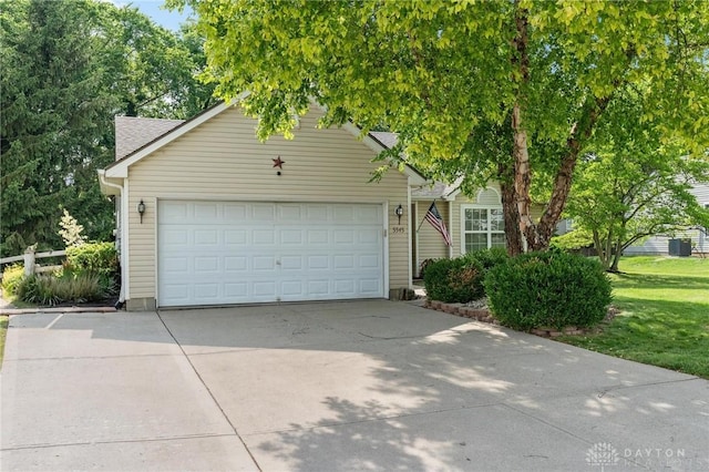 5545 Stone Path Dr, Middletown, OH 45042 - view of property hidden behind natural elements with driveway and a garage