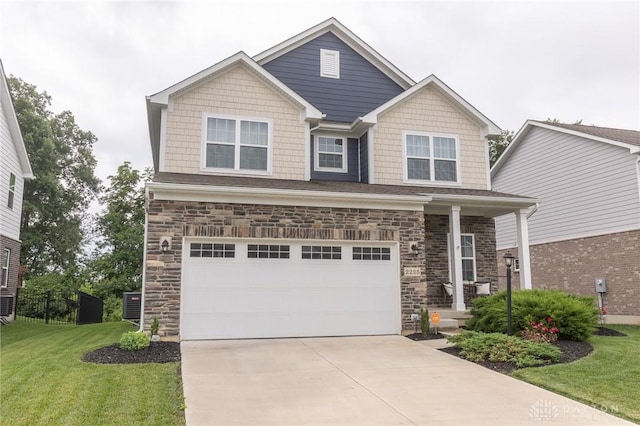 2225 Cold Stream Dr, Clearcreek Twp, OH 45458 - craftsman-style house with a garage, a front yard, stone siding, and driveway