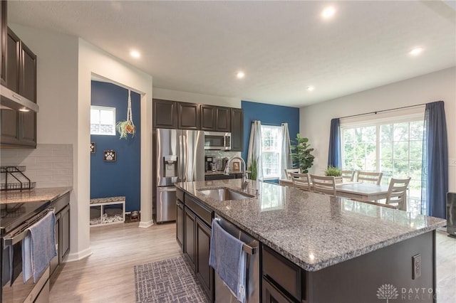 2225 Cold Stream Dr, Clearcreek Twp, OH 45458 - kitchen with appliances with stainless steel finishes, decorative backsplash, light stone counters, and recessed lighting