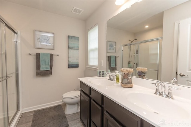 2225 Cold Stream Dr, Clearcreek Twp, OH 45458 - bathroom featuring an enclosed shower, double vanity, and wood finished floors