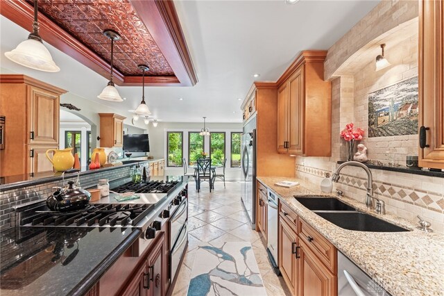 255 Belle Watlin Ct, Dayton, OH 45434 - kitchen featuring a tray ceiling, recessed lighting, stainless steel appliances, backsplash, and light stone countertops